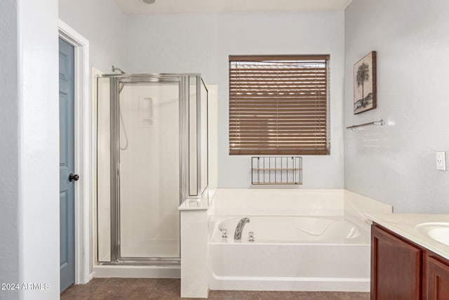 bathroom featuring tile patterned flooring, vanity, and independent shower and bath