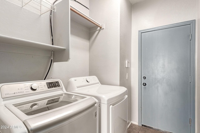 laundry room featuring separate washer and dryer and tile patterned floors