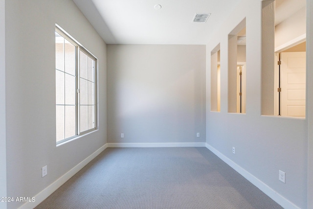 empty room with light colored carpet