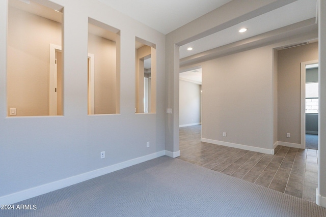 unfurnished living room featuring sink and light hardwood / wood-style floors