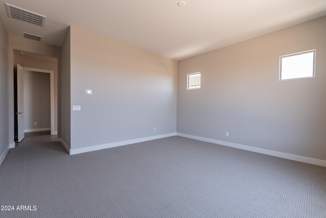 unfurnished room featuring carpet