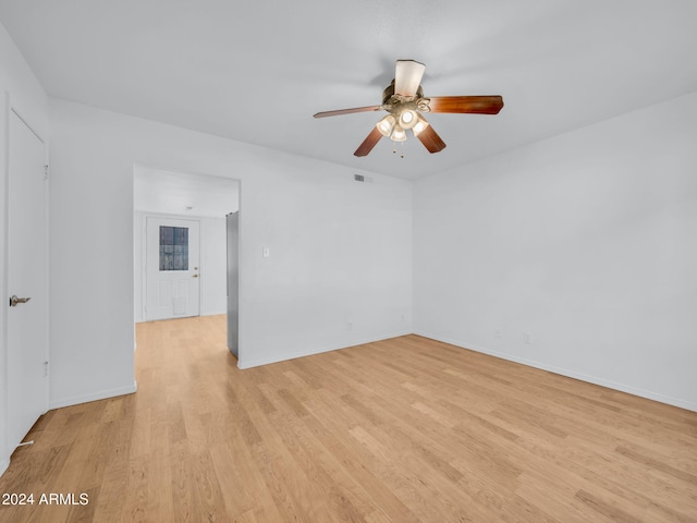 empty room featuring ceiling fan and light wood-type flooring