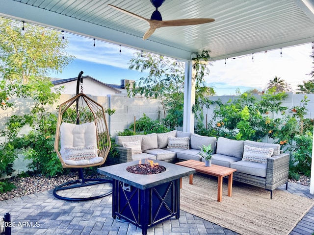 view of patio / terrace featuring an outdoor living space with a fire pit and ceiling fan