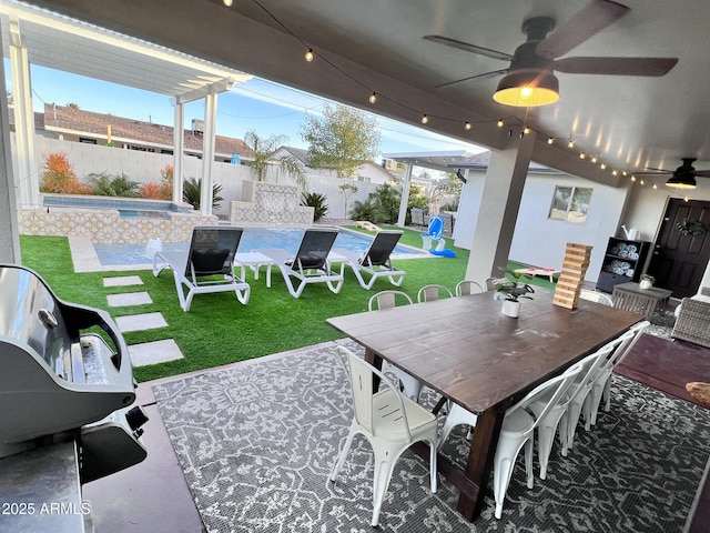 view of patio with a fenced in pool and ceiling fan