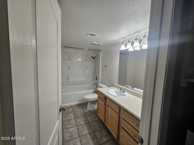 bathroom featuring toilet, vanity, a textured ceiling, tile patterned floors, and tub / shower combination