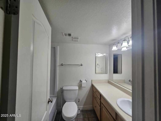 full bath with a textured ceiling, toilet, visible vents, tile patterned flooring, and vanity