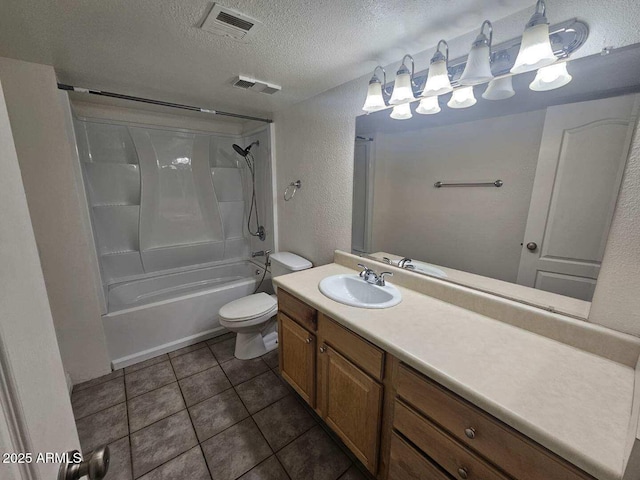 bathroom featuring a textured ceiling, toilet, visible vents, and tile patterned floors
