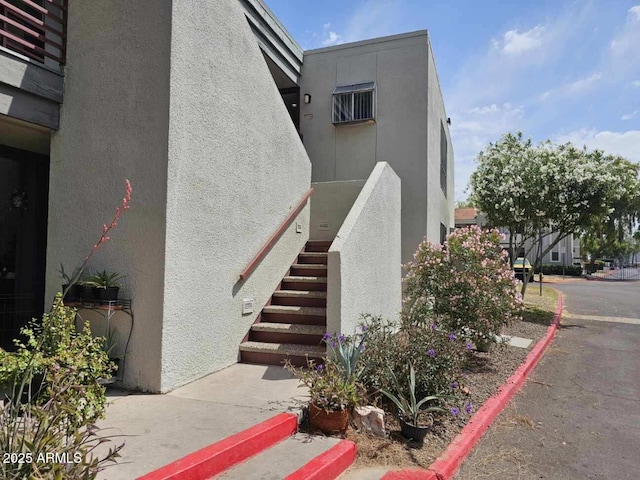property entrance featuring stucco siding