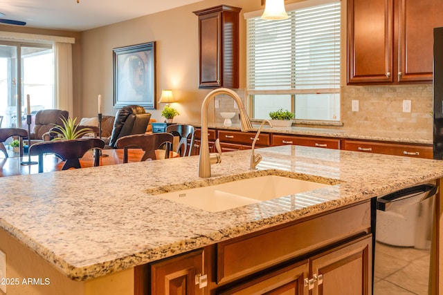 20742 E Mockingbird Dr, Queen Creek, AZ 85142 - kitchen with backsplash, open floor plan, light stone counters, and a sink
