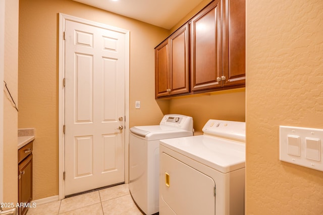 20742 E Mockingbird Dr, Queen Creek, AZ 85142 - clothes washing area featuring cabinet space, a textured wall, light tile patterned floors, and separate washer and dryer