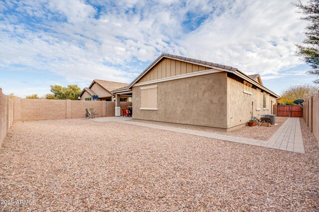 20742 E Mockingbird Dr, Queen Creek, AZ 85142 - rear view of house with stucco siding, a fenced backyard, and a patio