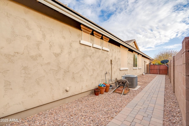 20742 E Mockingbird Dr, Queen Creek, AZ 85142 - view of side of property with a fenced backyard and central air condition unit