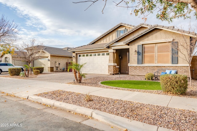 20742 E Mockingbird Dr, Queen Creek, AZ 85142 - view of front of house featuring stucco siding, an attached garage, driveway, and stone siding