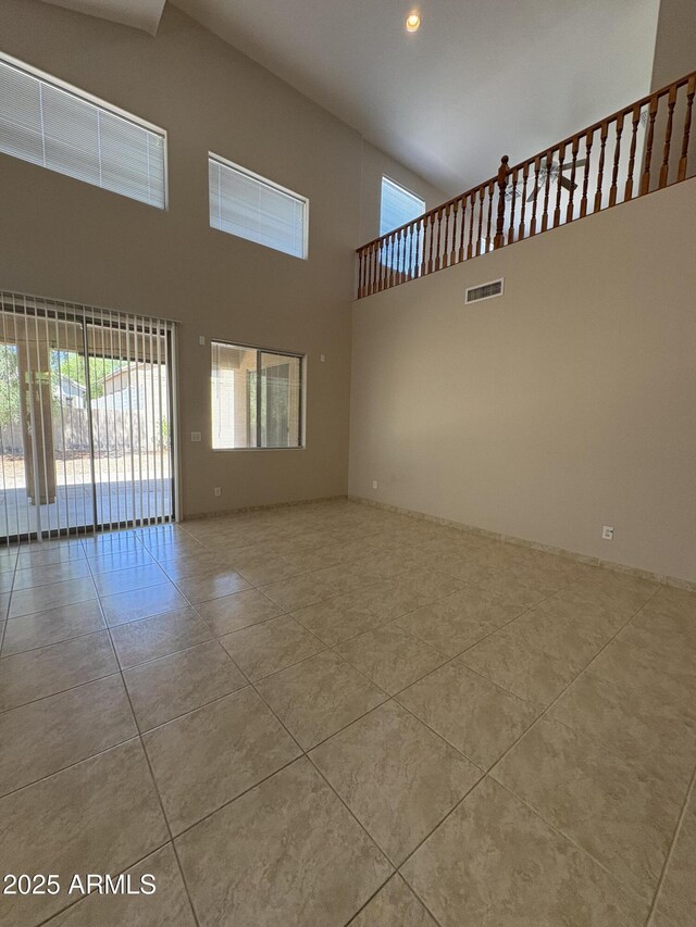 33512 N 24th Ln, Phoenix, AZ 85085 - unfurnished room featuring tile patterned floors, a towering ceiling, and recessed lighting
