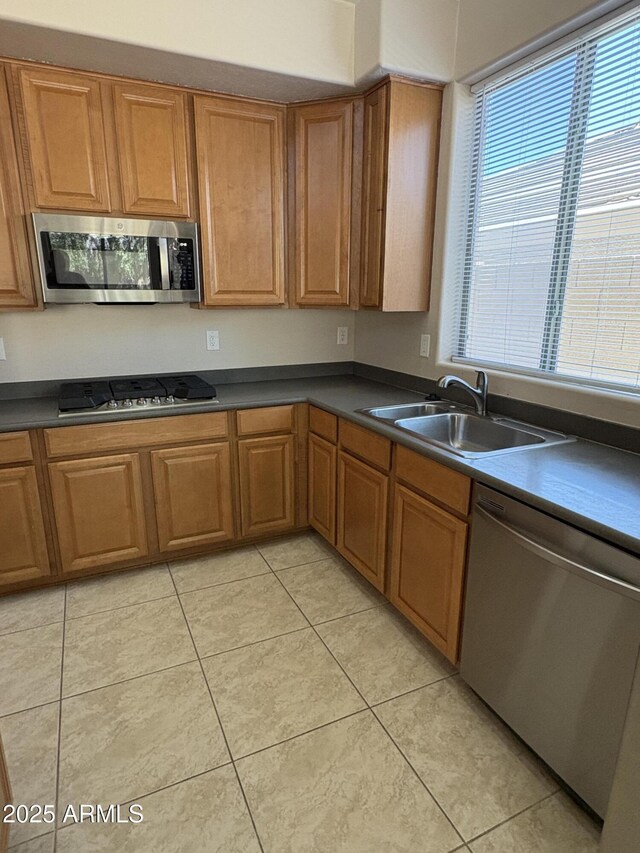 33512 N 24th Ln, Phoenix, AZ 85085 - kitchen with stainless steel appliances, a sink, dark countertops, and light tile patterned flooring