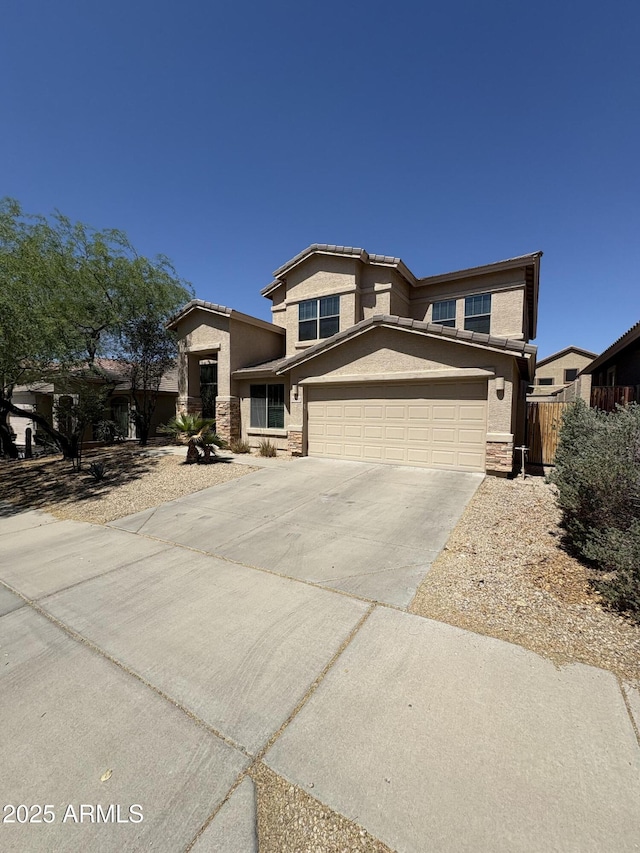 33512 N 24th Ln, Phoenix, AZ 85085 - view of front of home with stucco siding, driveway, and stone siding