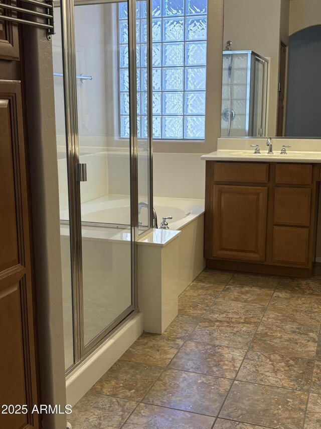 33512 N 24th Ln, Phoenix, AZ 85085 - full bathroom with a stall shower, a garden tub, vanity, and stone finish flooring