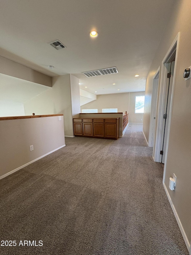 33512 N 24th Ln, Phoenix, AZ 85085 - unfurnished living room with carpet floors, baseboards, and recessed lighting