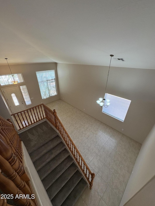 33512 N 24th Ln, Phoenix, AZ 85085 - staircase with a chandelier and tile patterned flooring