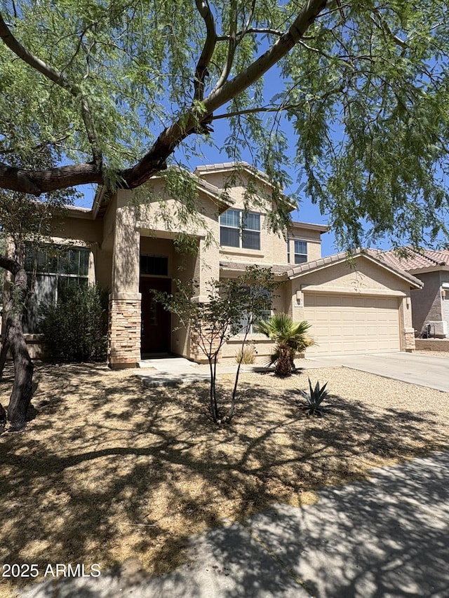33512 N 24th Ln, Phoenix, AZ 85085 - view of front of property featuring stucco siding, concrete driveway, an attached garage, and a tile roof