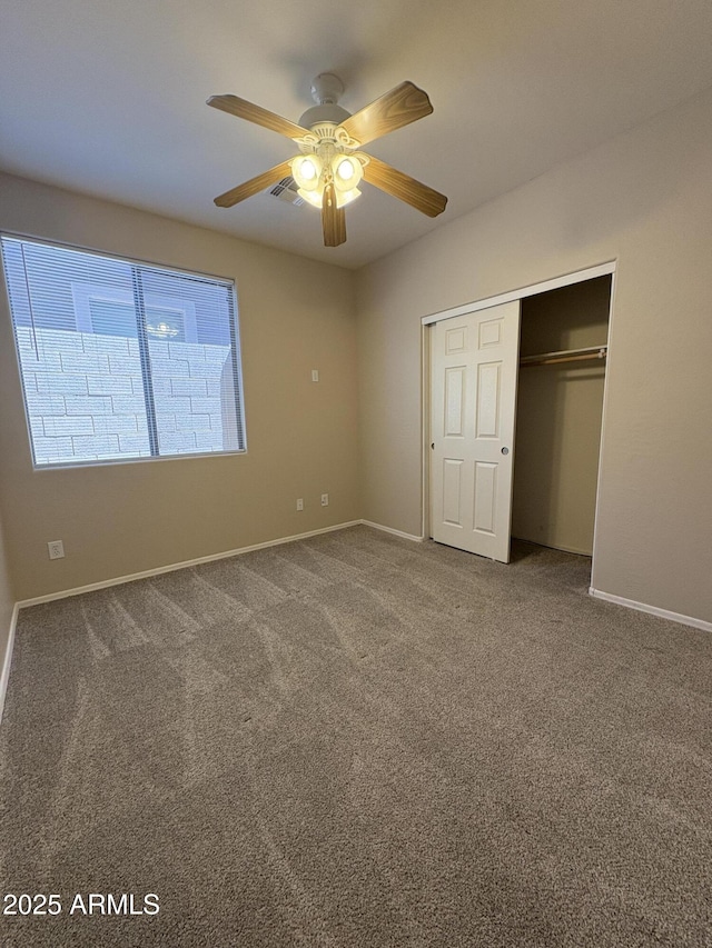 33512 N 24th Ln, Phoenix, AZ 85085 - unfurnished bedroom featuring a closet, carpet flooring, and baseboards
