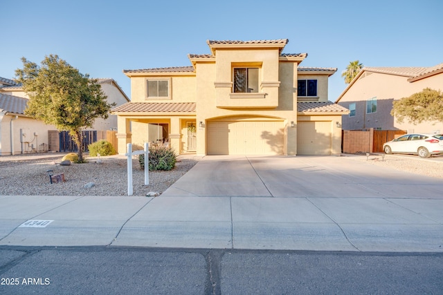 mediterranean / spanish-style house featuring a garage