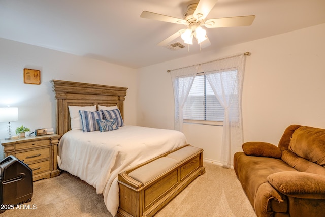 bedroom featuring ceiling fan and light carpet