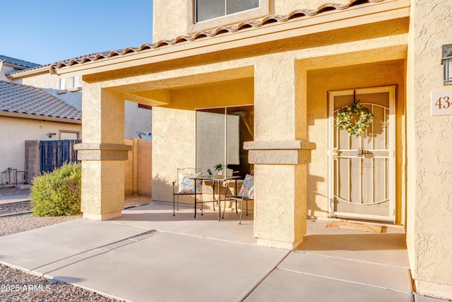 property entrance featuring a patio