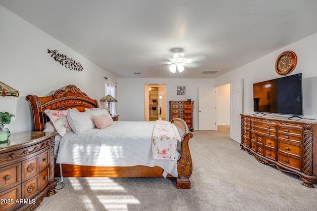 bedroom featuring ceiling fan and light carpet