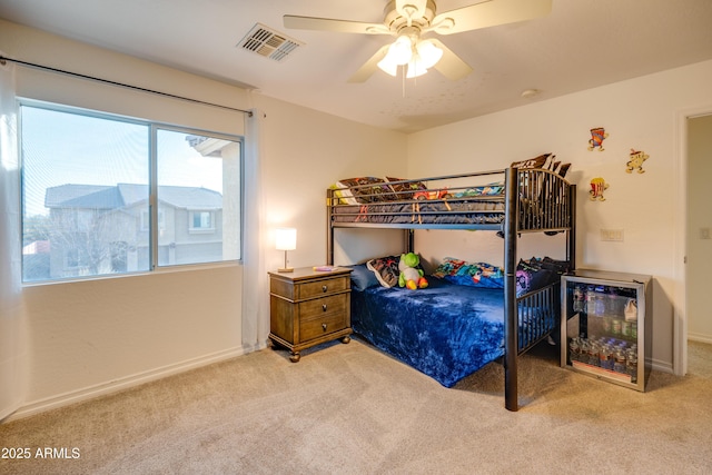 bedroom with ceiling fan and light colored carpet