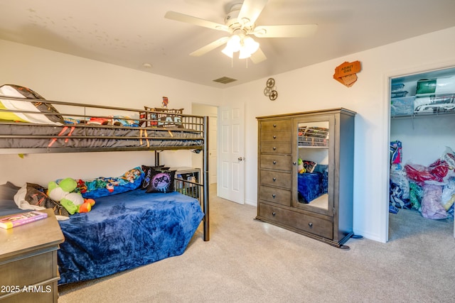 bedroom featuring ceiling fan and light carpet