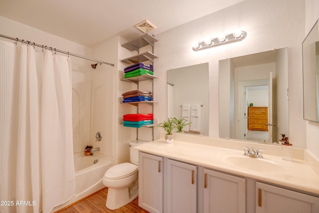 full bathroom with wood-type flooring, toilet, vanity, and shower / bath combo