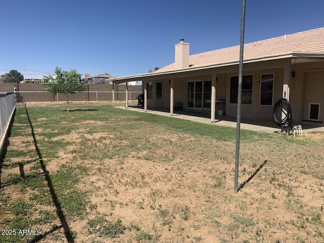 view of yard with a patio and a fenced backyard