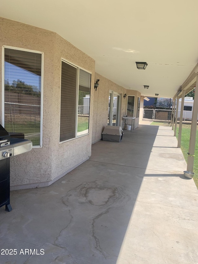view of patio / terrace featuring fence