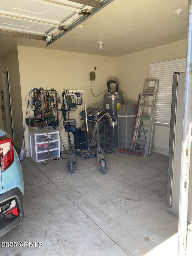 garage featuring refrigerator and water heater