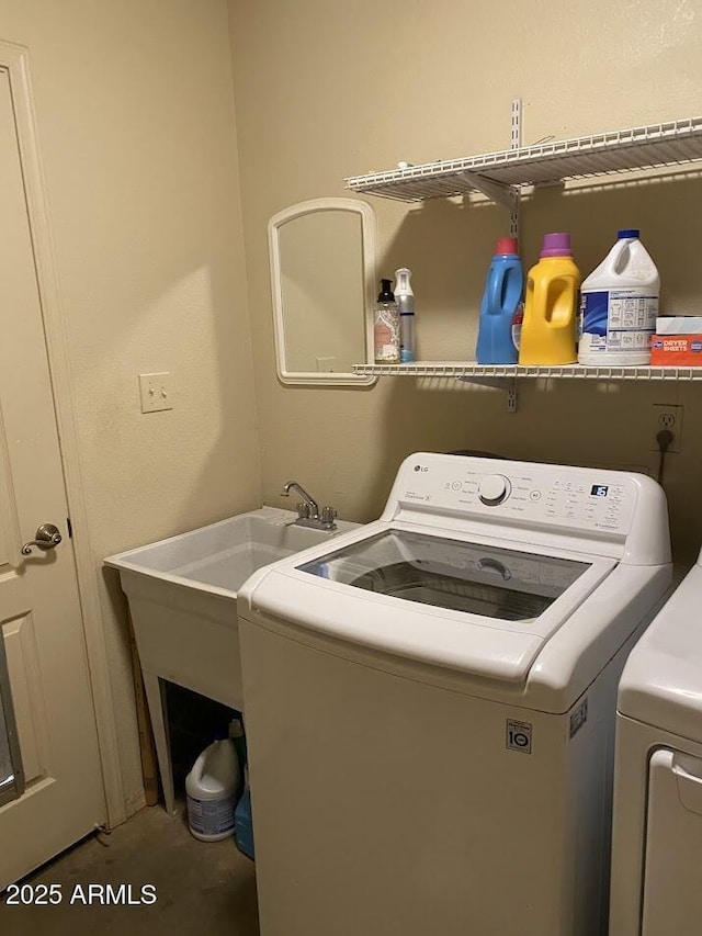 laundry room with washer and dryer and laundry area
