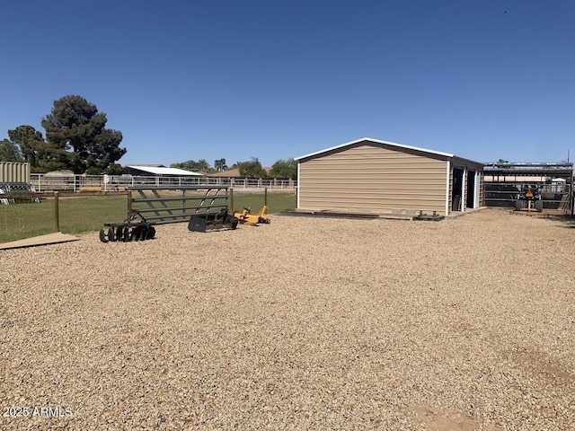 view of yard with an exterior structure and an outbuilding