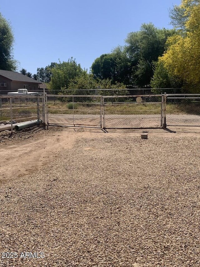 view of yard featuring fence and a gate