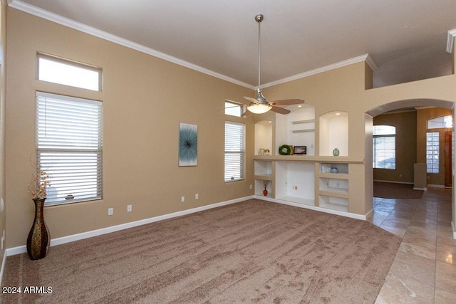 interior space featuring ceiling fan and ornamental molding