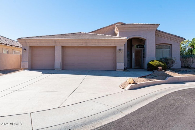 view of front of property featuring a garage