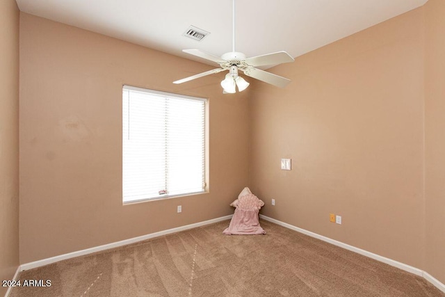 spare room with ceiling fan and carpet floors