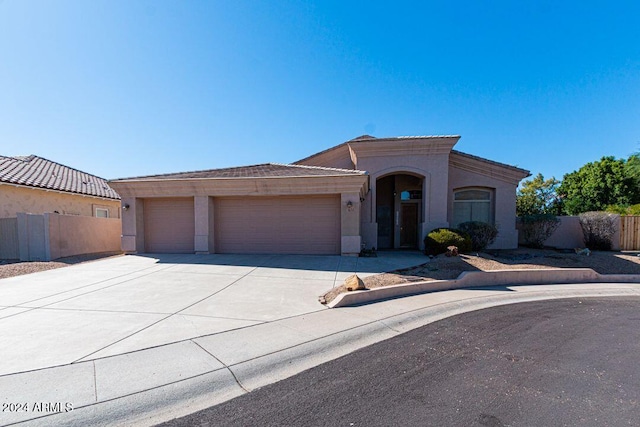 view of front of property featuring a garage