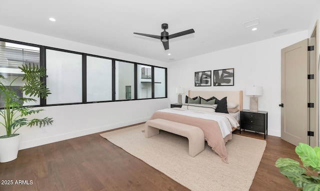 bedroom featuring ceiling fan and dark hardwood / wood-style floors