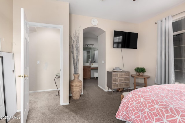 carpeted bedroom with ensuite bath