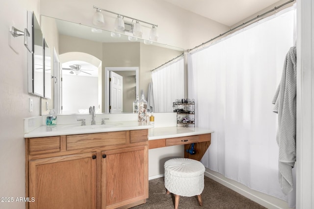 bathroom with a shower with curtain, vanity, and ceiling fan