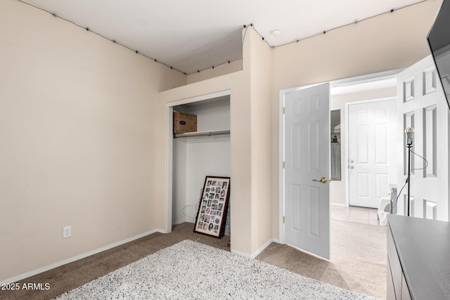 carpeted bedroom with a closet