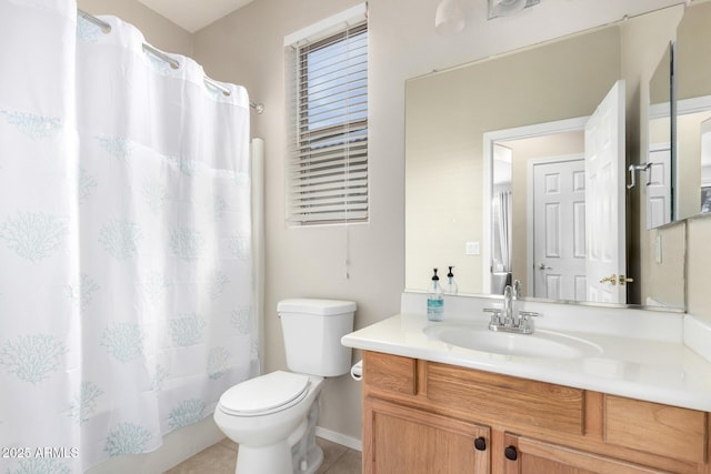 full bathroom with tile patterned floors, shower / bath combo with shower curtain, vanity, and toilet