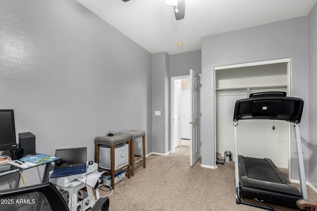 exercise room featuring ceiling fan and light carpet