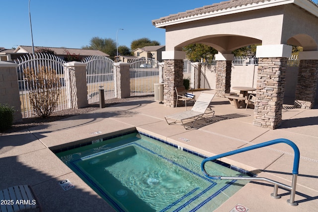 view of pool with a patio area and a community hot tub