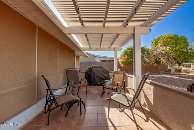 view of patio featuring area for grilling, a fenced backyard, and a pergola